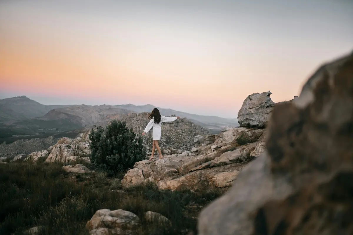 Woman Standing Alone on a Mountain at Sunset – Post 2 Featured Image
