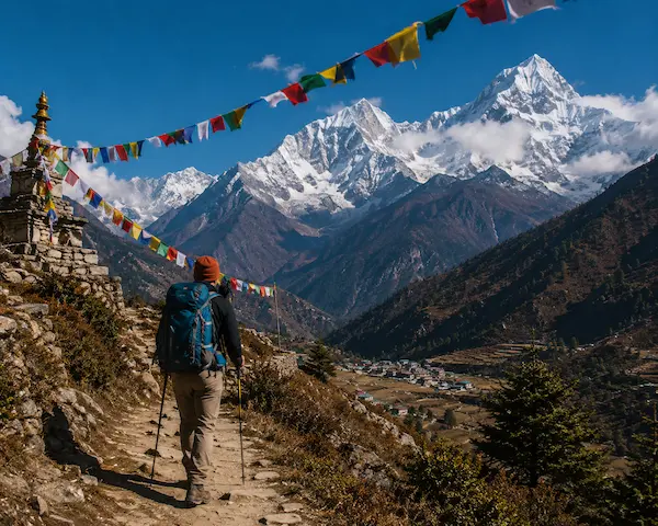 About David Hibbins trekking through the Himalayan mountains of Nepal, reflecting a passion for adventure, travel, exploration, and the real-world experiences that inspire his writing.